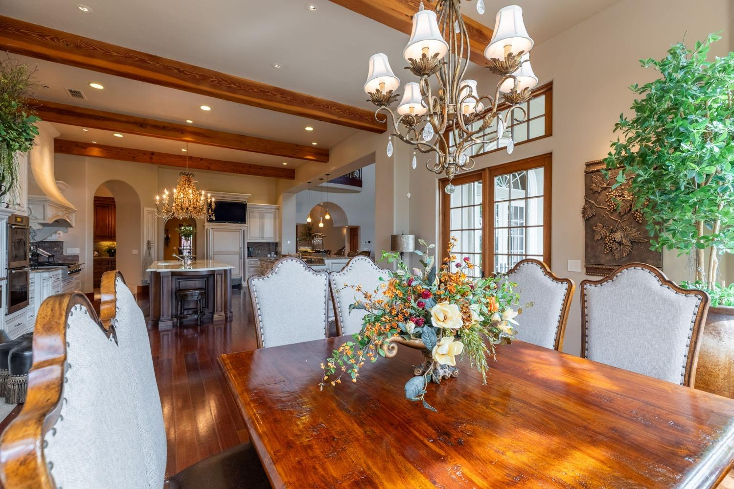 1140 Cold Springs Road Placerville, CA 95667 - Photo 29 of 98 a view of a dining room with furniture a chandelier and wooden floor