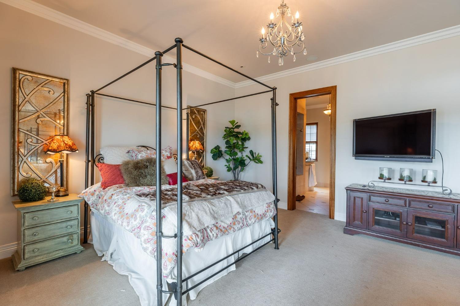 1140 Cold Springs Road Placerville, CA 95667 - Photo 56 of 98 a bedroom with a bed and a flat tv screen on dresser