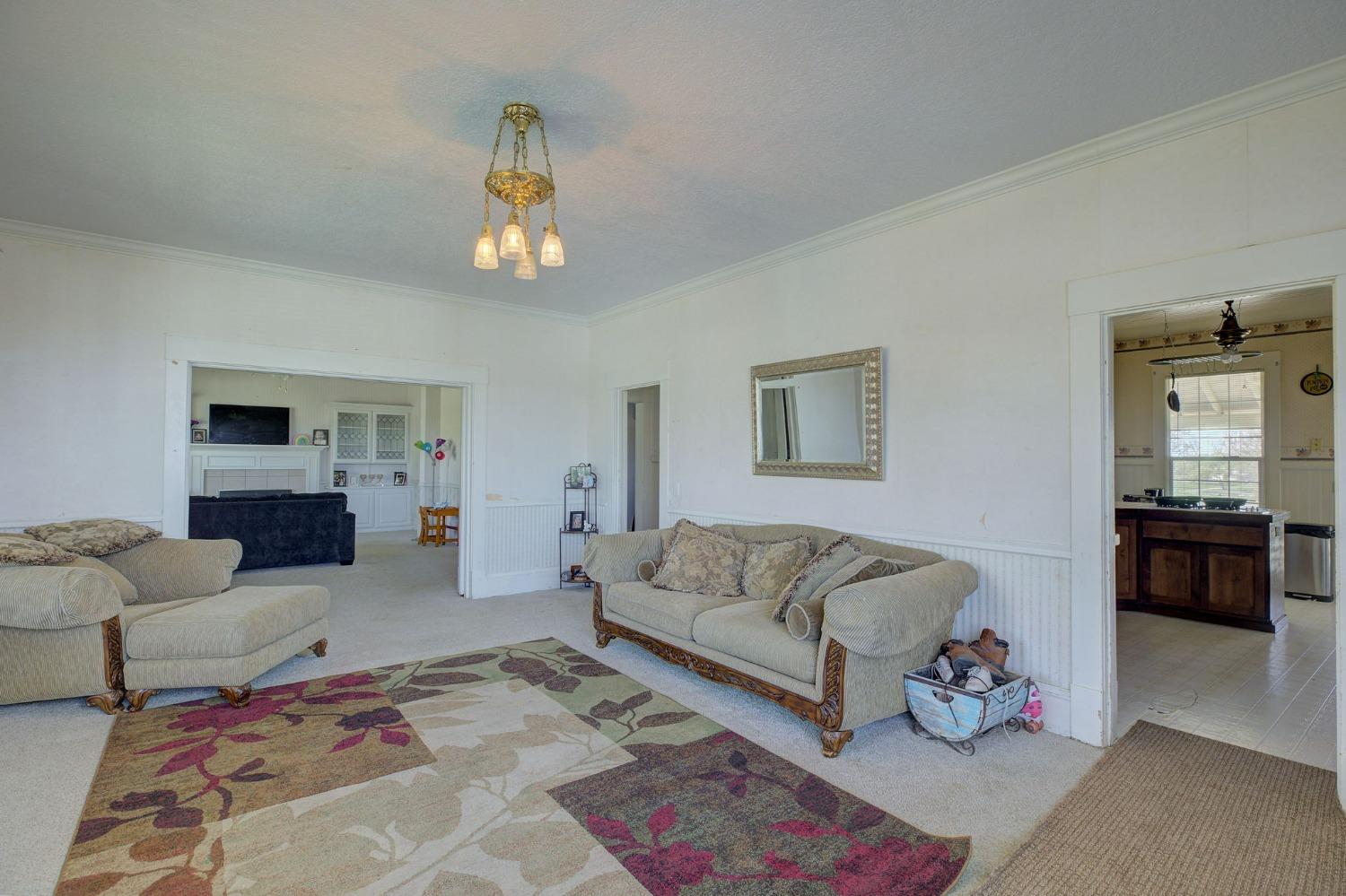 1140 Cold Springs Road Placerville, CA 95667 - Photo 85 of 98 a living room with furniture ceiling fan and a rug