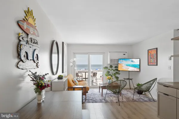 a view of a livingroom with furniture and wooden floor