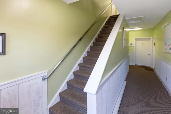 a kitchen with stainless steel appliances a refrigerator sink and cabinets