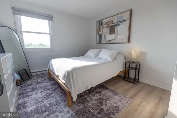 a view of a dining room with furniture and a potted plant