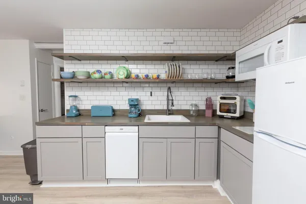 a bedroom with a bed and a chair