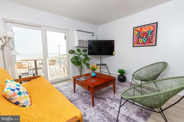 a bathroom with a toilet and a mirror