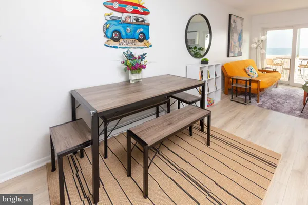 a bathroom with a granite countertop toilet sink and a mirror