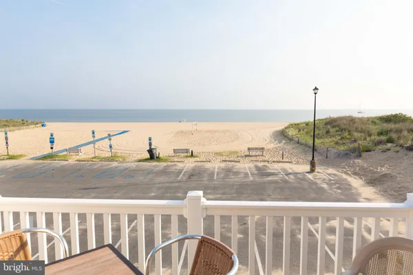 a front view of a house with a garden and yard