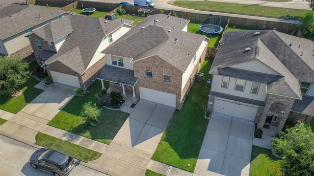 an aerial view of a house with a garden
