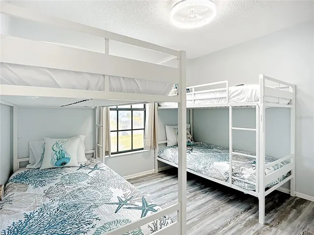 a view of a chairs and table in patio with a backyard