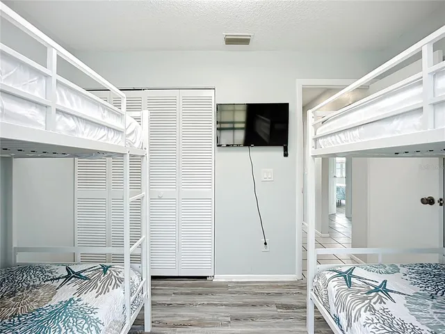 a view of a house with swimming pool and porch with furniture