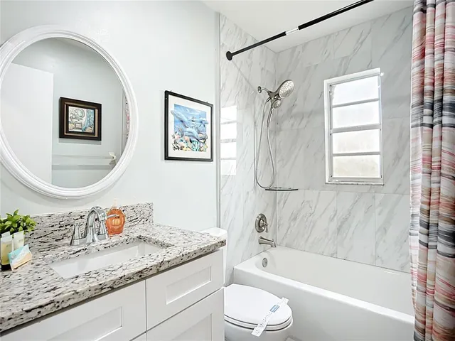 a view of a house with swimming pool and sitting area