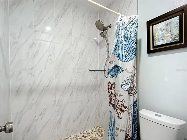 a bird view of a house with a backyard