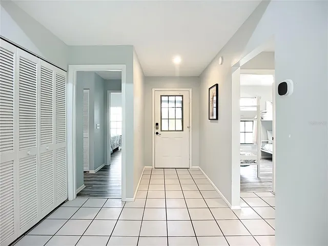 a view of a dining room with furniture and a window
