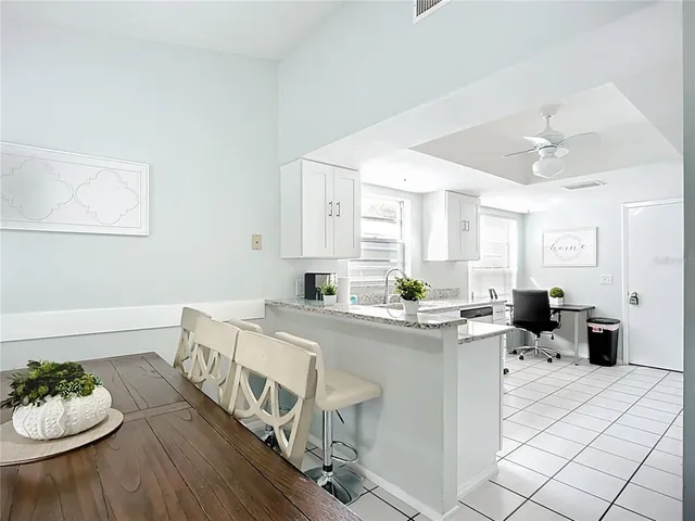 a kitchen with a sink cabinets and stainless steel appliances