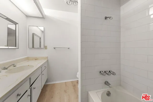 a bathroom with a bathtub and a toilet