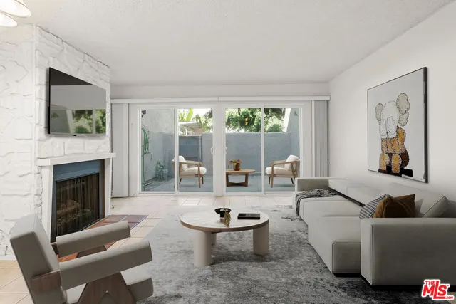 a view of an empty room with a fireplace