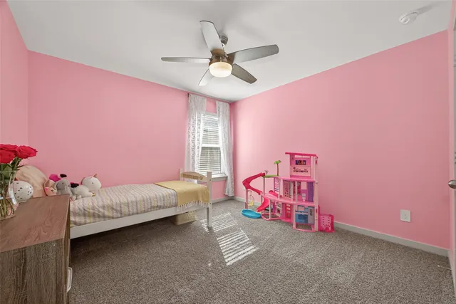 a bedroom with furniture and a window
