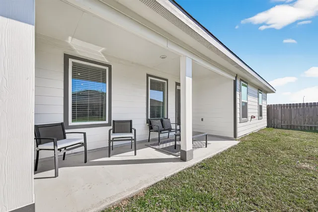 a view of a house with a backyard and a garden