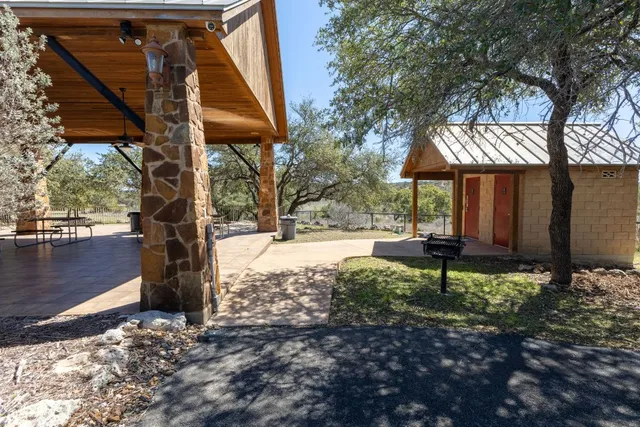 a view of a park with plants and a bench
