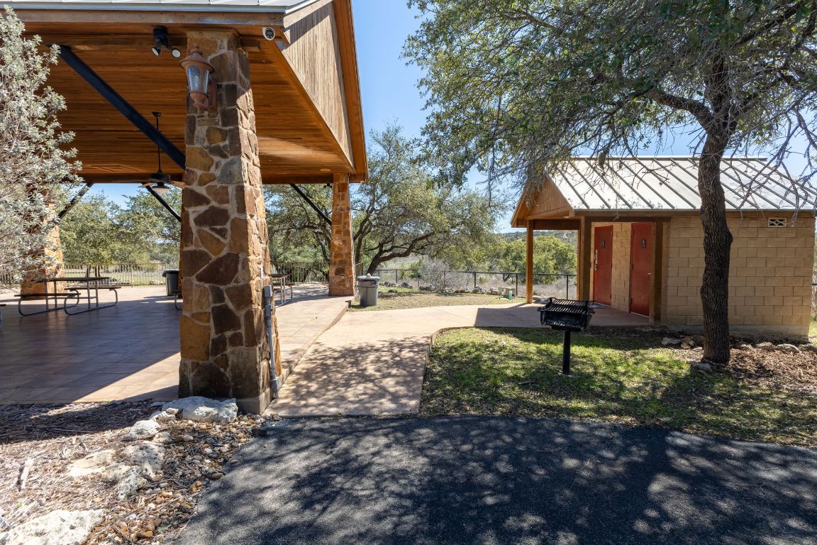 2232 San Jose Way Canyon Lake, TX 78133 - Photo 13 of 16 a view of a park with plants and a bench