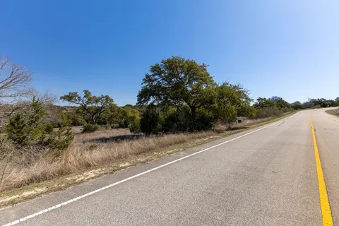 a view of a road with a building in the background