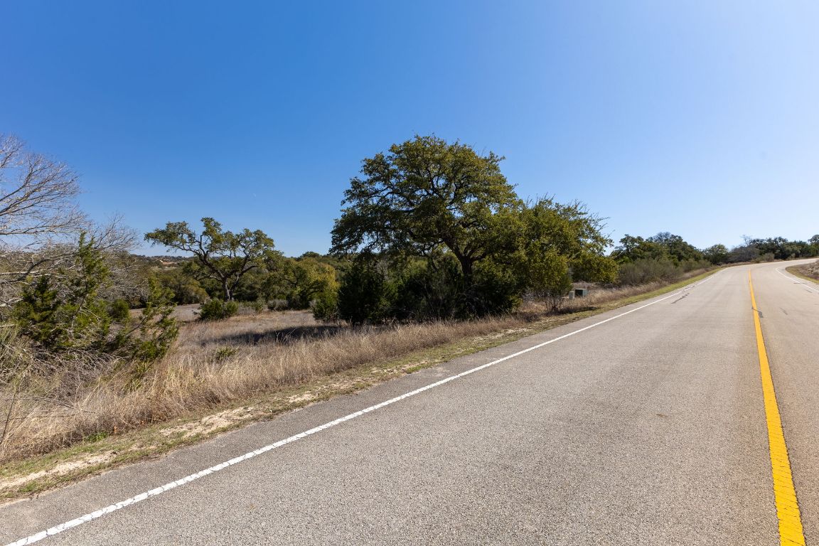 2232 San Jose Way Canyon Lake, TX 78133 - Photo 2 of 16 a view of a road with a building in the background