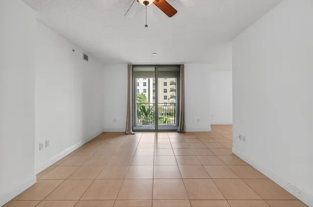 a view of a kitchen with a sink and a window