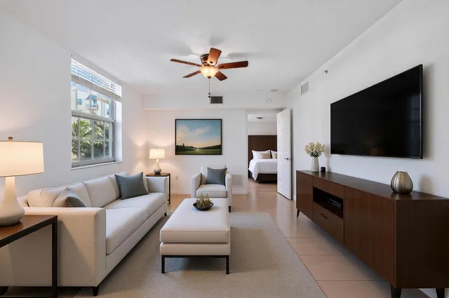 a kitchen with granite countertop a sink stove and cabinets