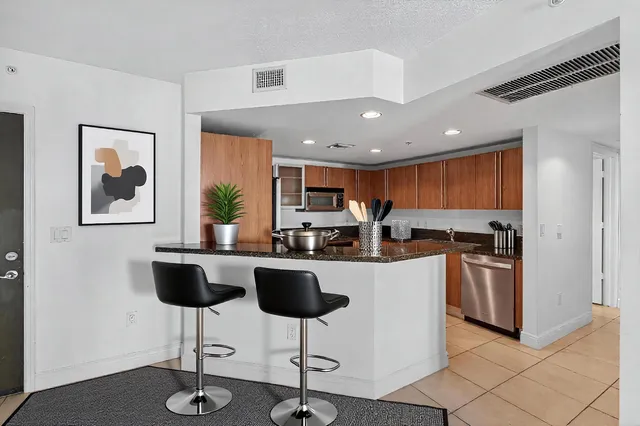 a view of a swimming pool with a garden and plants