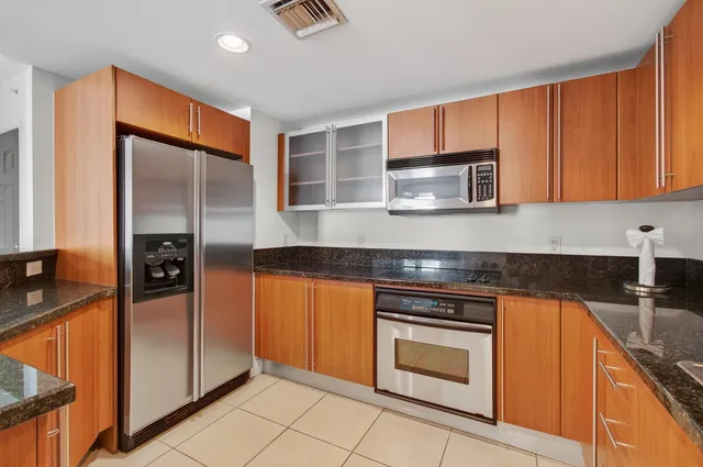 a bedroom with a large bed and a couch