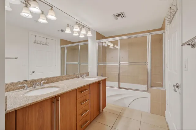 a view of swimming pool with outdoor seating and plants