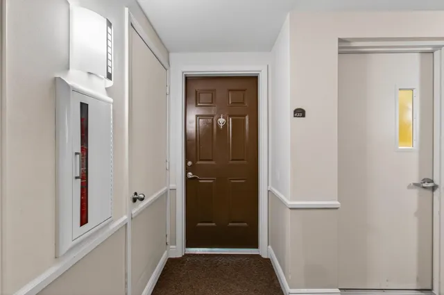 a view of an empty room with a window