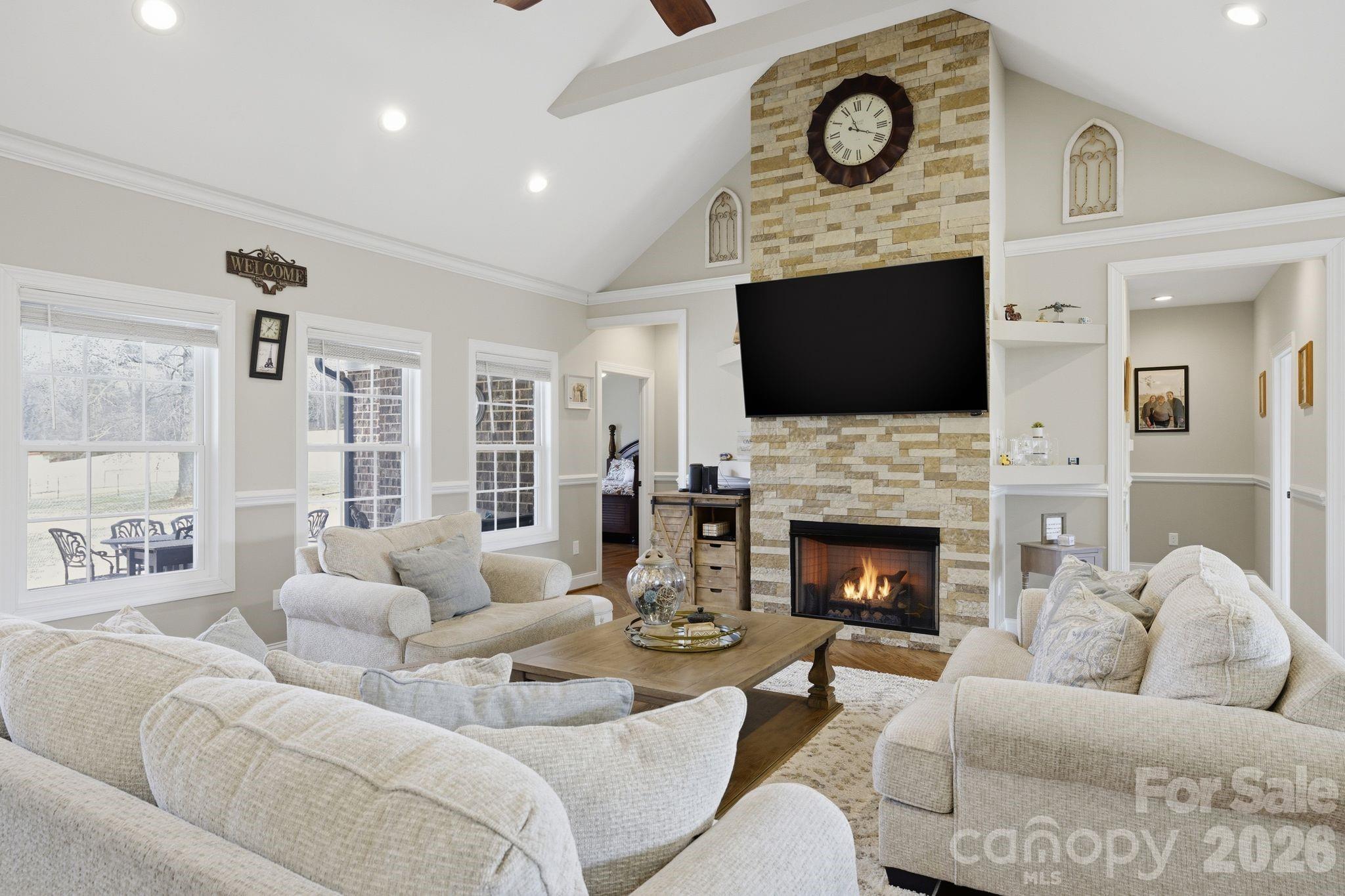 1370 Null Road, Unit 4 Lincolnton, NC 28092 - Photo 13 of 47 a living room with furniture a fireplace and a flat screen tv