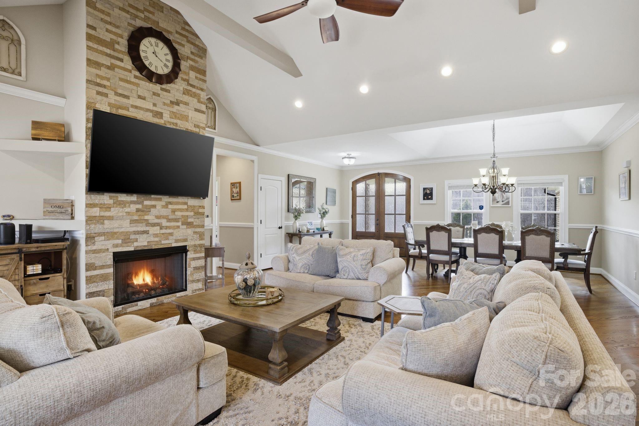 1370 Null Road, Unit 4 Lincolnton, NC 28092 - Photo 15 of 47 a living room with furniture a fireplace and a flat screen tv