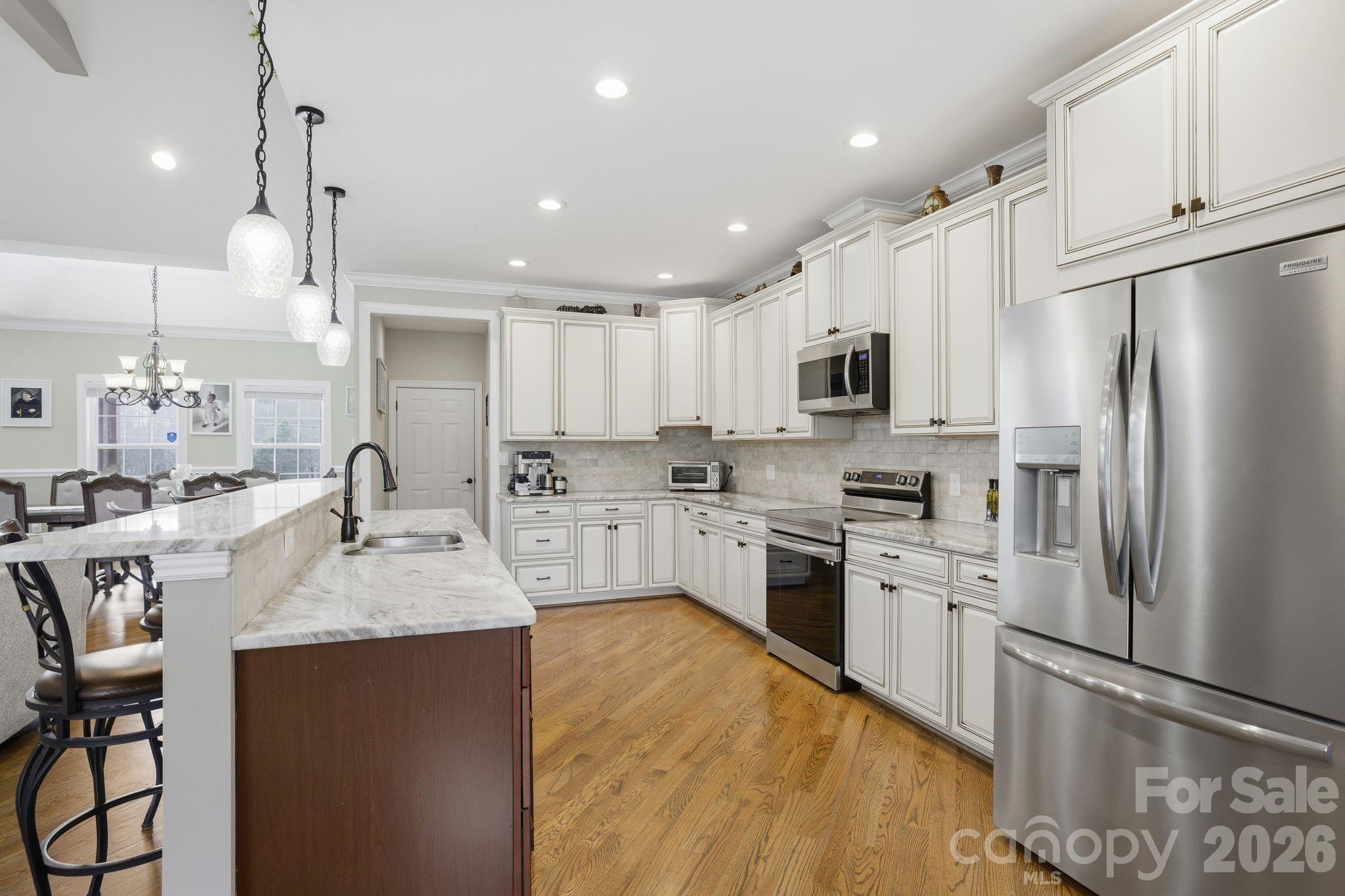 1370 Null Road, Unit 4 Lincolnton, NC 28092 - Photo 17 of 47 a large kitchen with granite countertop lots of counter top space appliances and cabinets