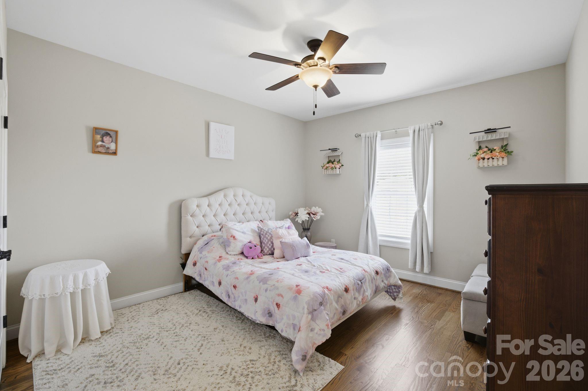 1370 Null Road, Unit 4 Lincolnton, NC 28092 - Photo 29 of 47 a bedroom with a bed and a refrigerator