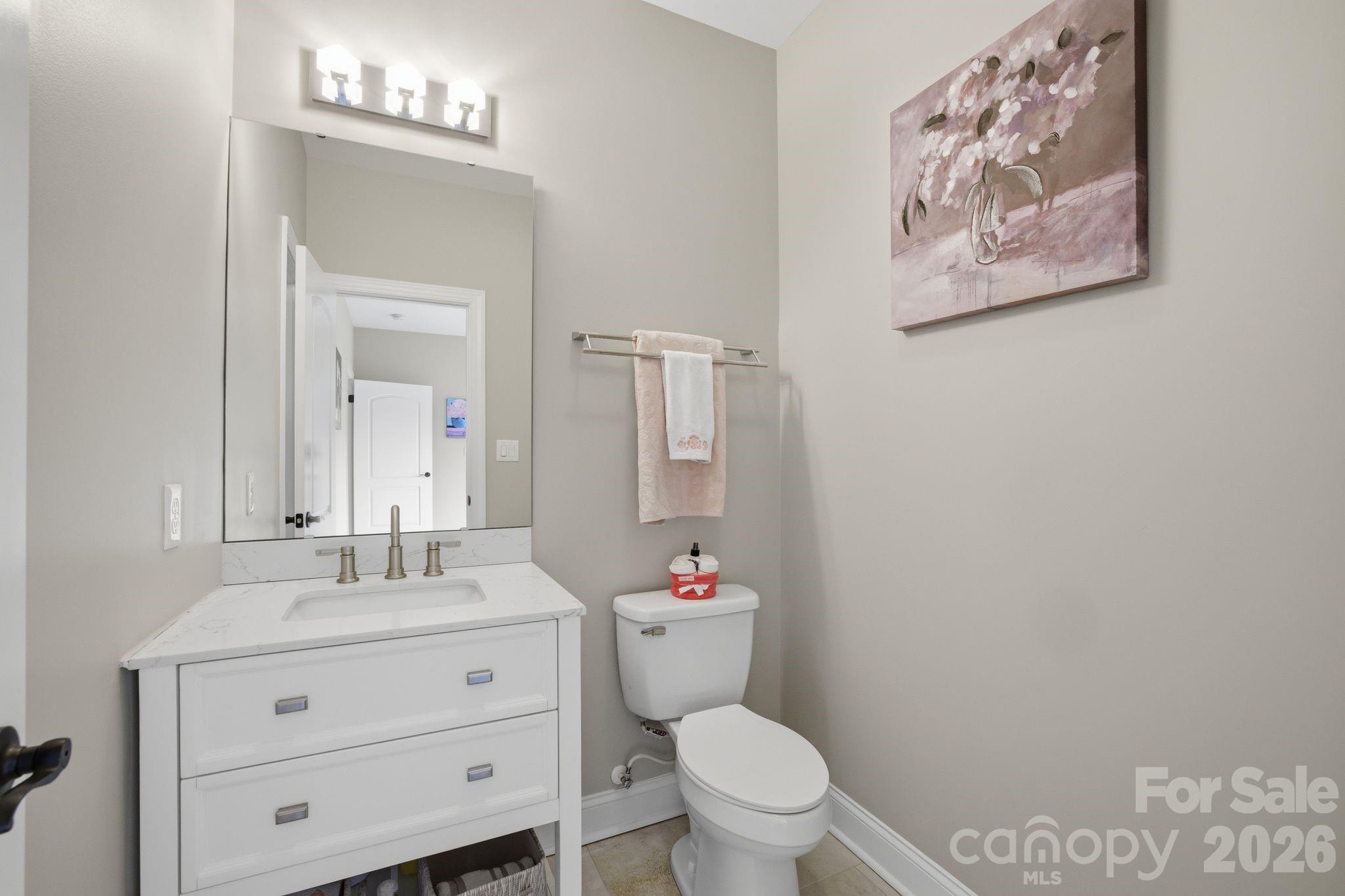 1370 Null Road, Unit 4 Lincolnton, NC 28092 - Photo 32 of 47 a bathroom with a toilet sink and mirror