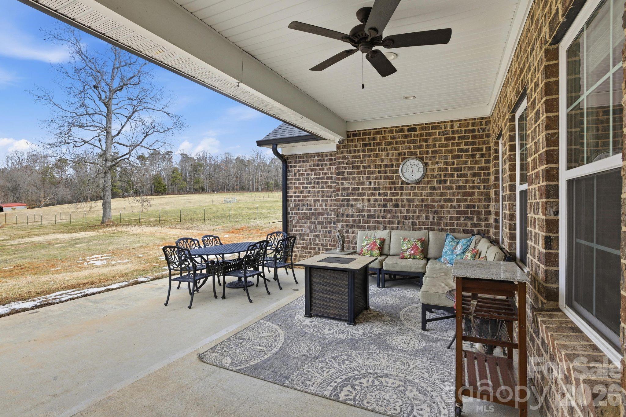1370 Null Road, Unit 4 Lincolnton, NC 28092 - Photo 41 of 47 a dining room with furniture and a floor to ceiling window