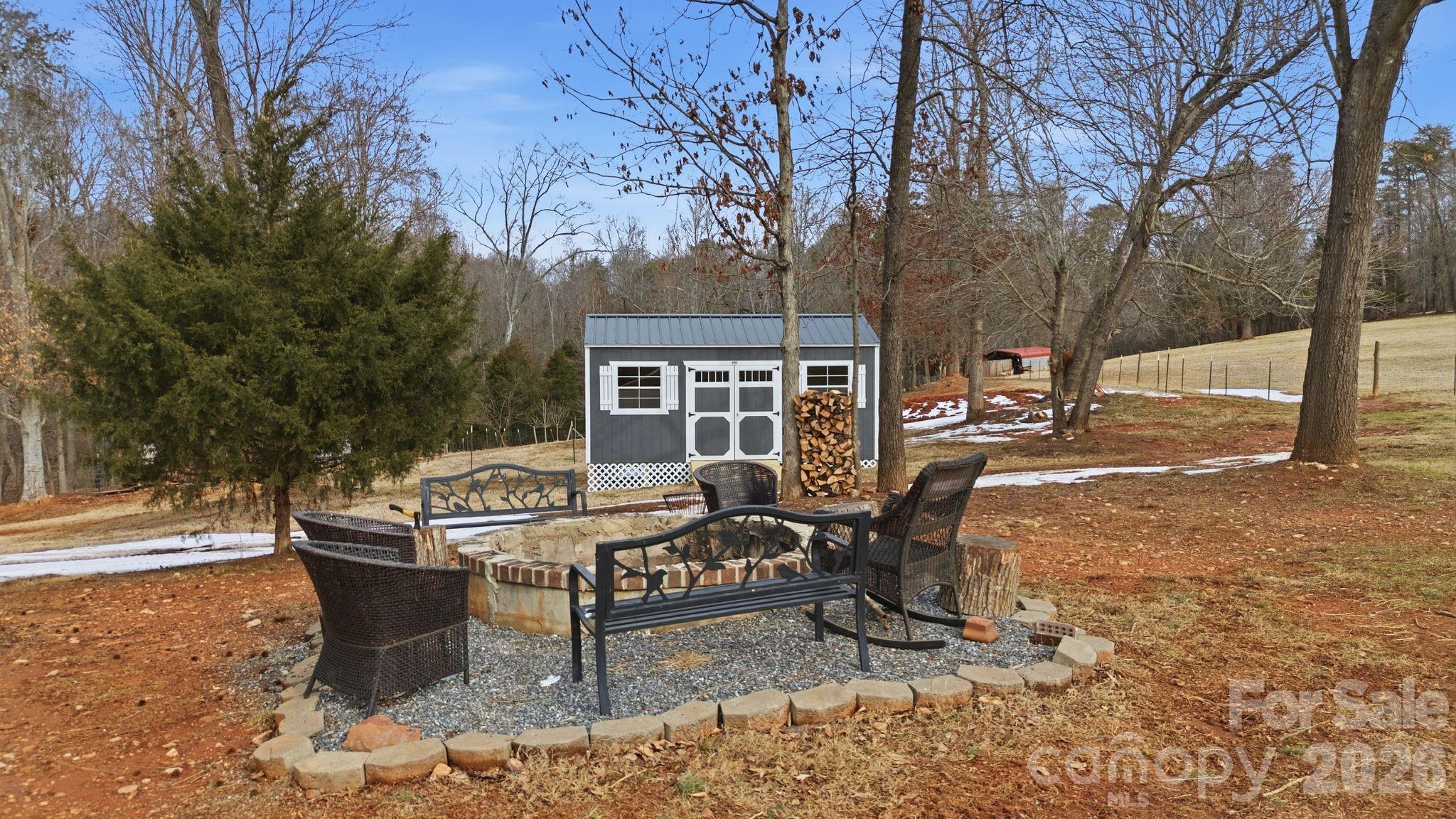 1370 Null Road, Unit 4 Lincolnton, NC 28092 - Photo 44 of 47 a view of a patio with table and chairs and potted plants