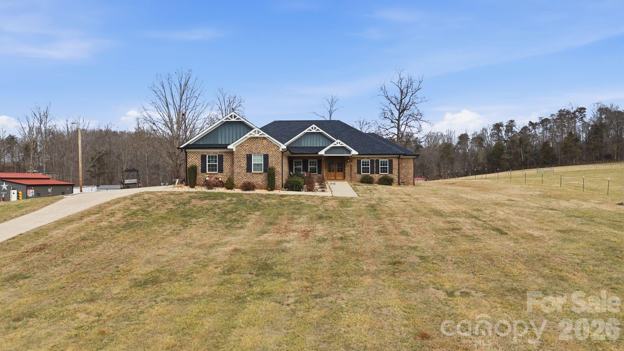 1370 Null Road, Unit 4 Lincolnton, NC 28092 - Photo 7 of 47 a front view of a house with a yard