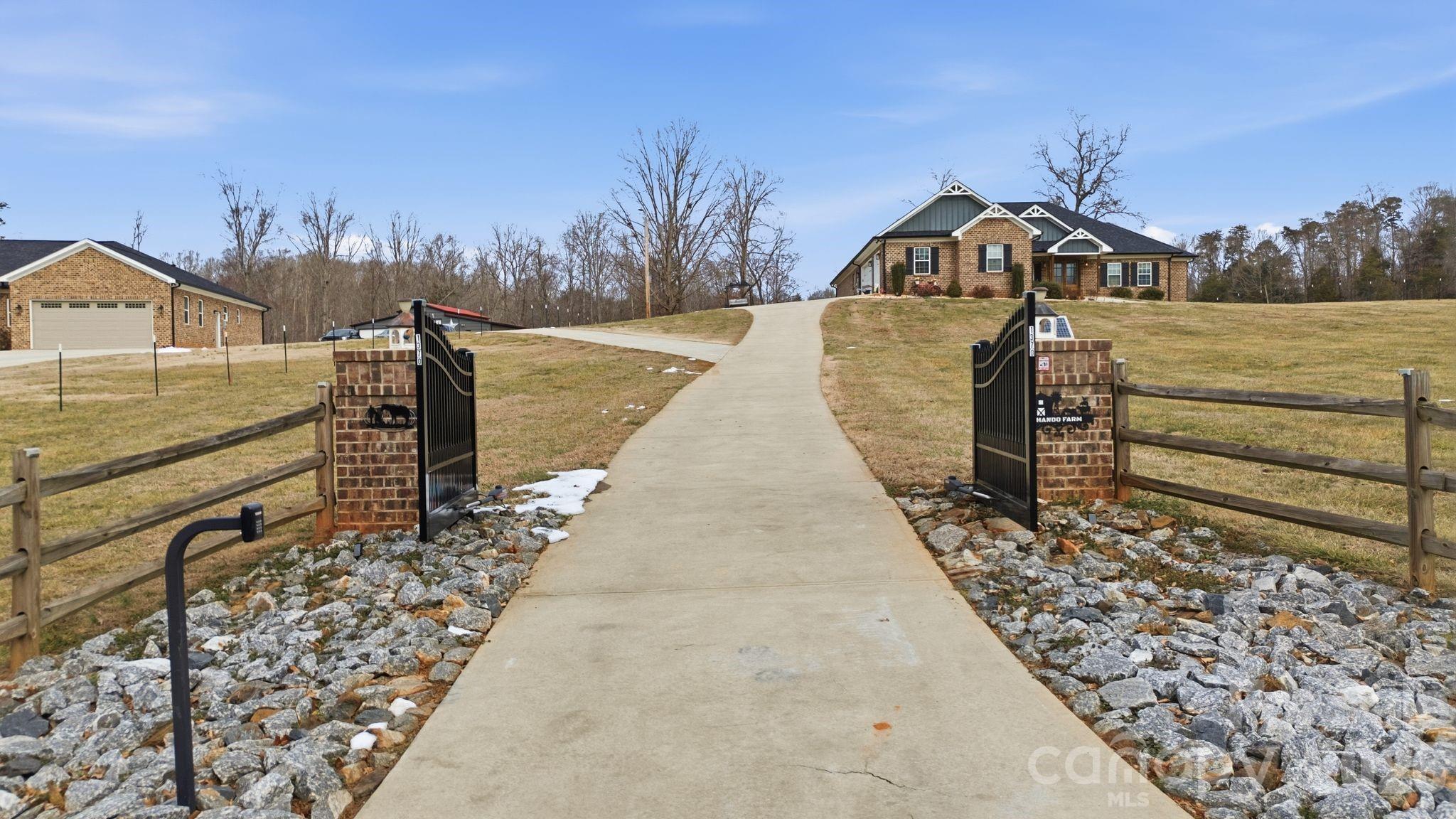 1370 Null Road, Unit 4 Lincolnton, NC 28092 - Photo 8 of 47 a view of a pathway with a wrought fence