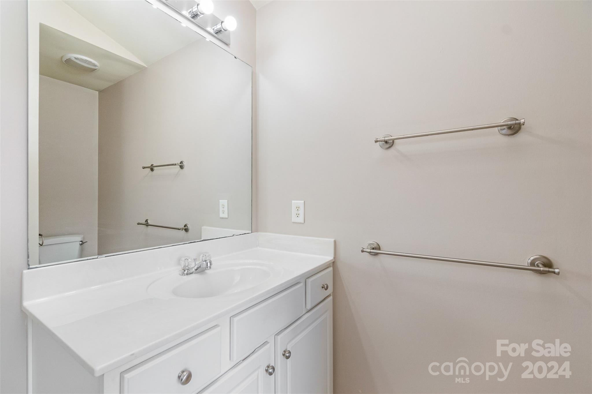 3320 Burnage Hall Road Harrisburg, NC 28075 - Photo 14 of 21 a bathroom with a sink and mirror