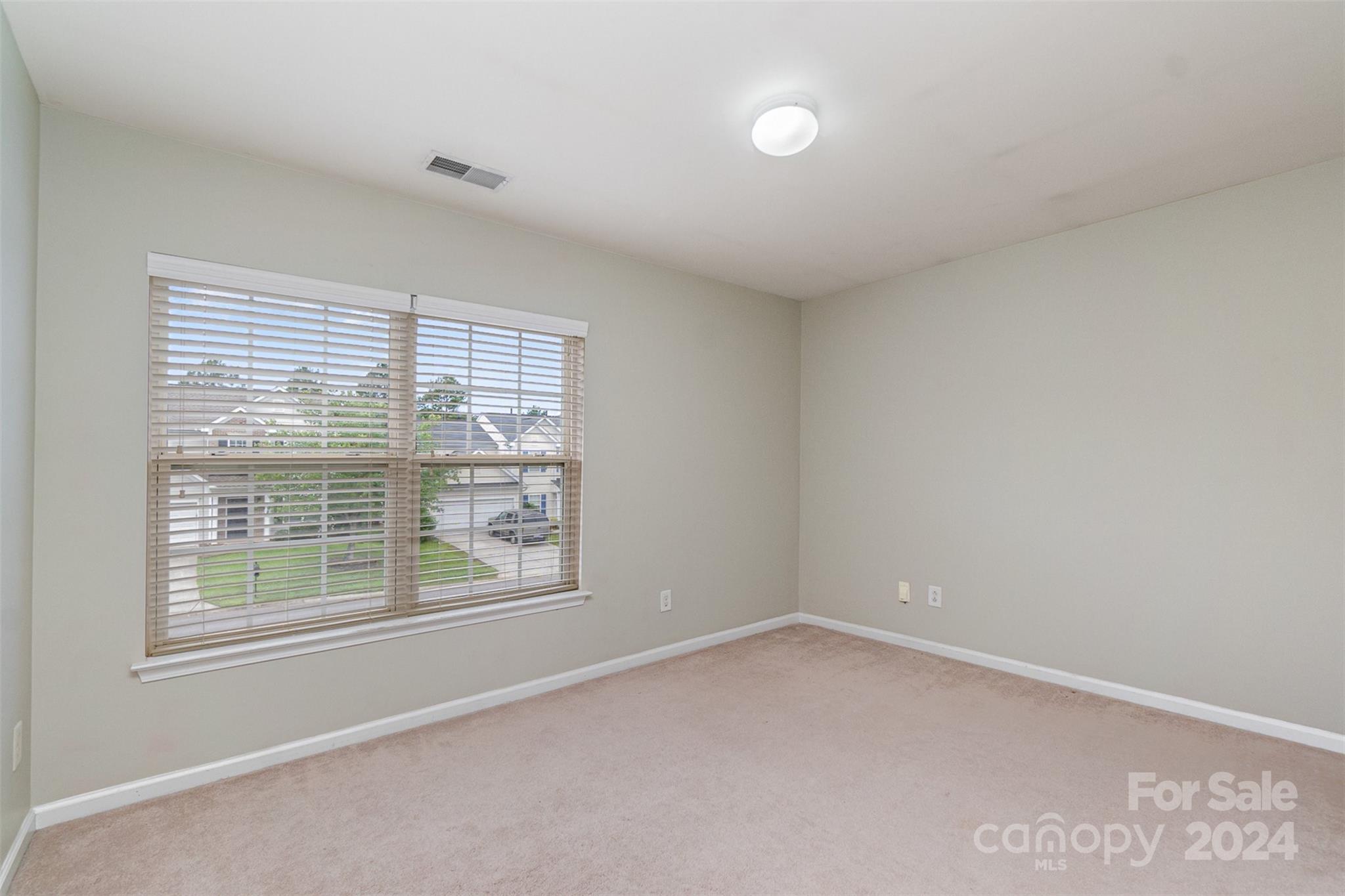 3320 Burnage Hall Road Harrisburg, NC 28075 - Photo 15 of 21 a view of an empty room with a window