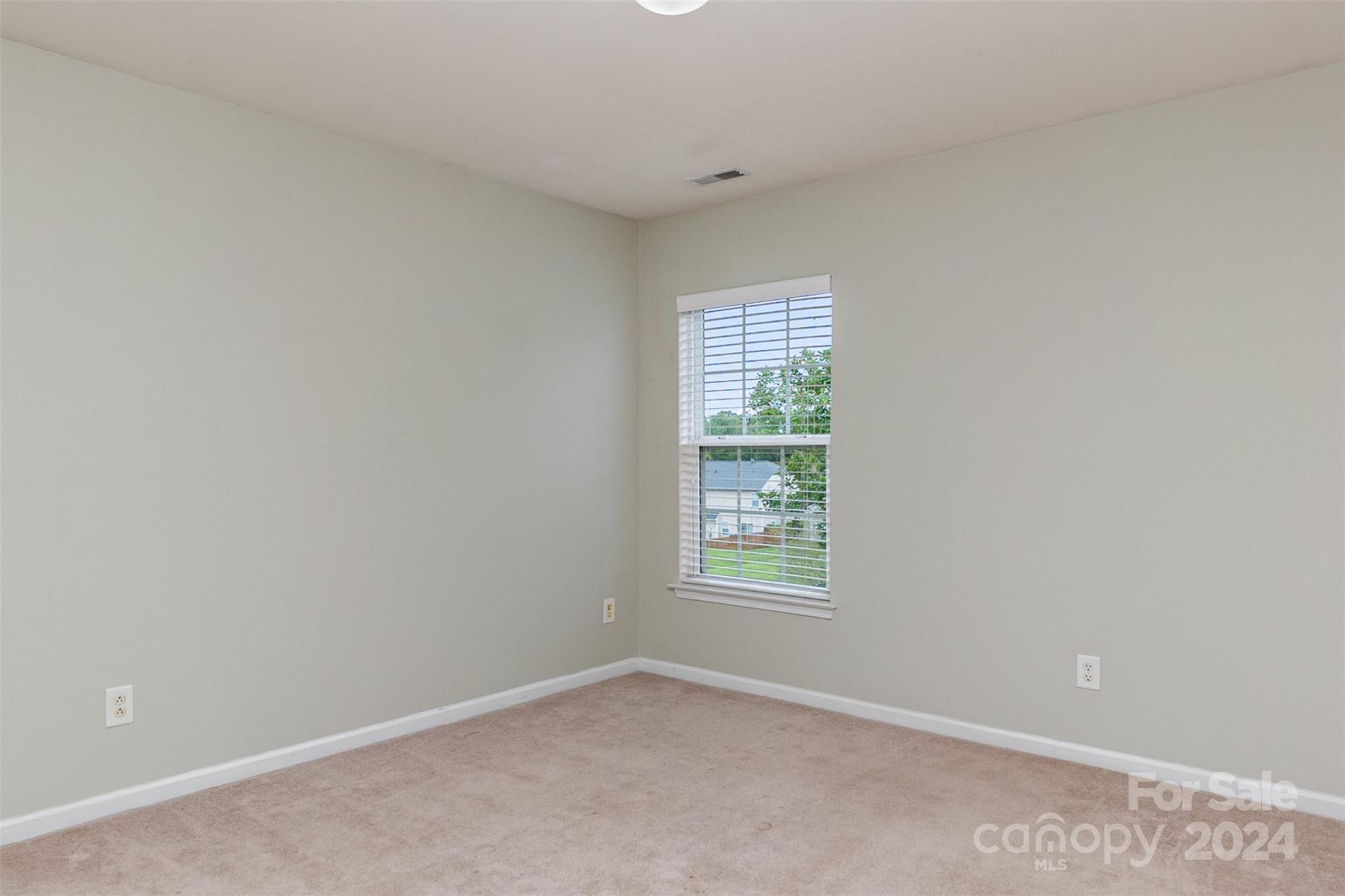 3320 Burnage Hall Road Harrisburg, NC 28075 - Photo 17 of 21 an empty room with windows