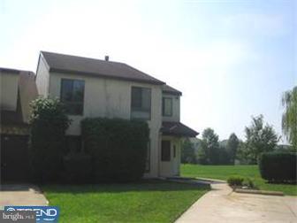42-44 Buttonwood Road Voorhees, NJ 08043 - Photo 1 of 6 a brick house with a small yard