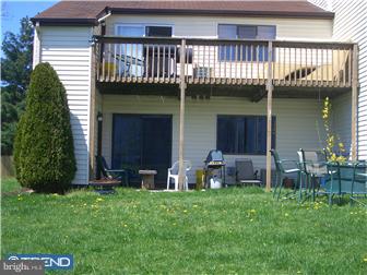 42-44 Buttonwood Road Voorhees, NJ 08043 - Photo 5 of 6 a backyard of a house with table and chairs