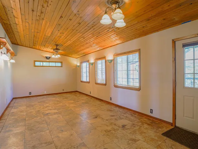 a view of an empty room with a window