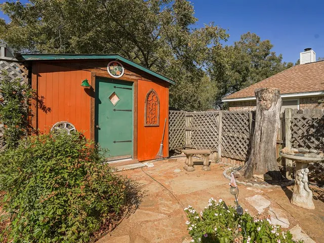 a backyard of a house with a tree