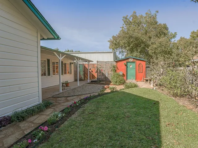 a view of a back yard of the house