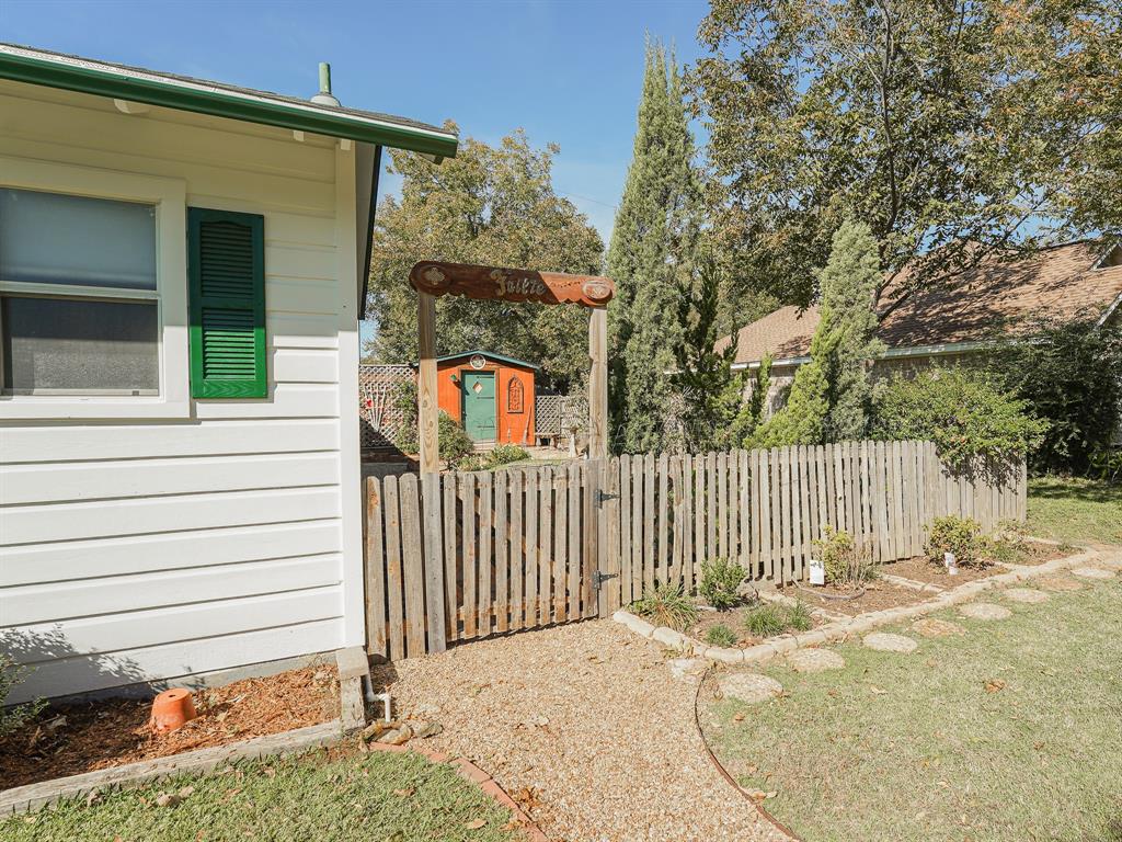 438 South Street Krum, TX 76249 - Photo 4 of 22 View of side of house entering the backyard!