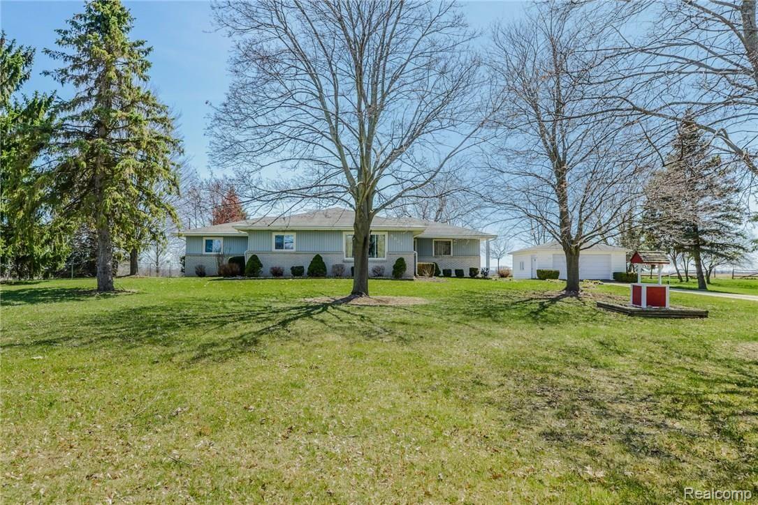5821 West Hayner Road Fowlerville, MI 48836 - Photo 2 of 21 Lots of room in this front yard, with mature trees